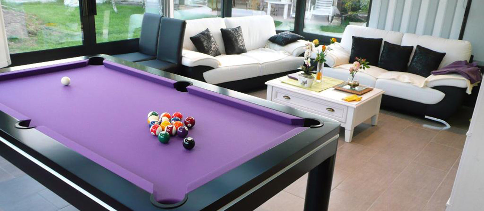 An elegant black pool table with sleek design