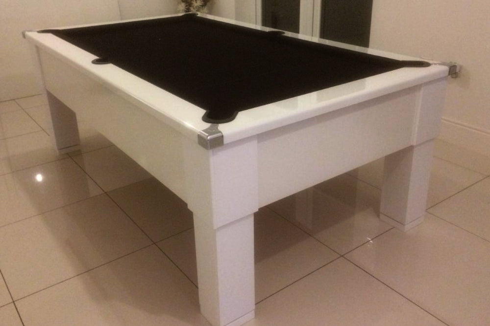 Gloss White Square Leg Pool Table with Black Cloth on White Tiled Floor
