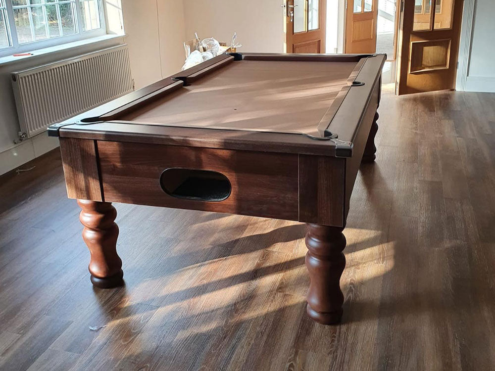 Dark Walnut Pool Table from reservoir end on a wooden laminate floor