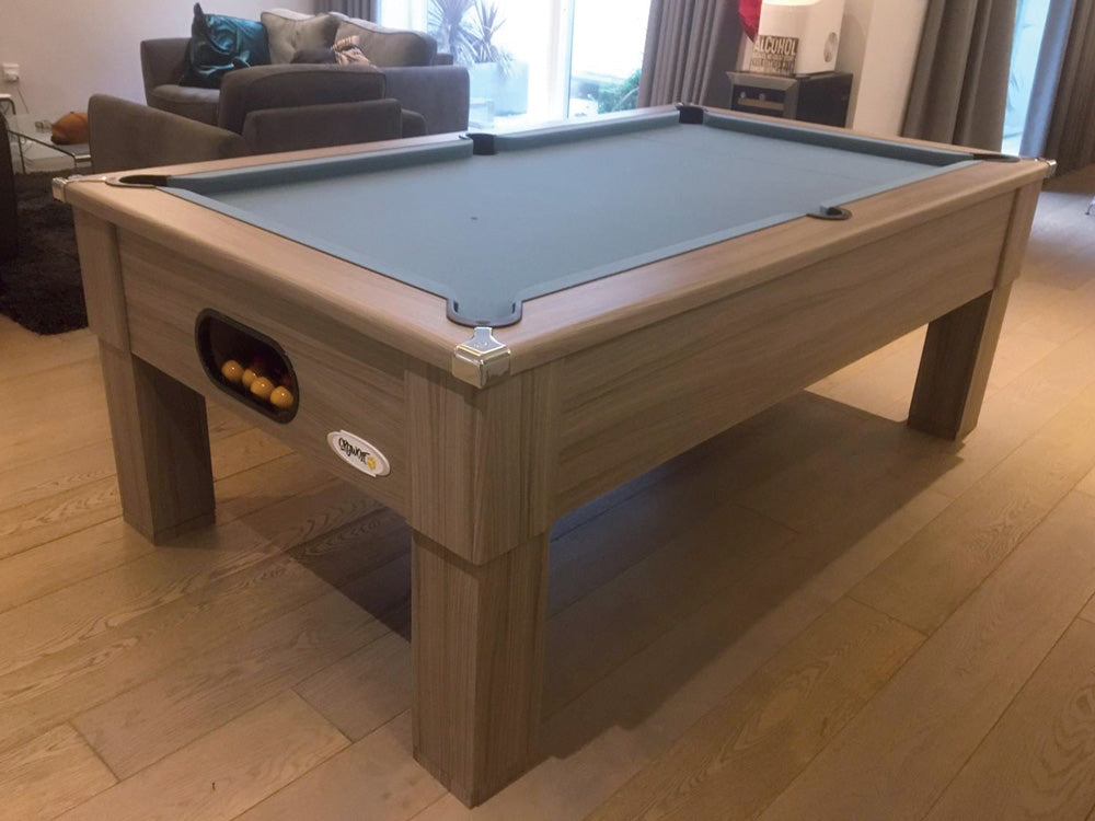Driftwood Square Leg 7ft Pool Table with slate cloth on wooden floor.