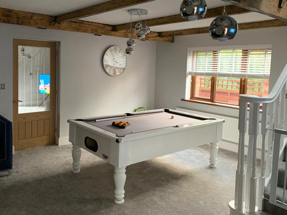 Gloss White Turned Leg Pool Table with grey cloth angled shot in cottage