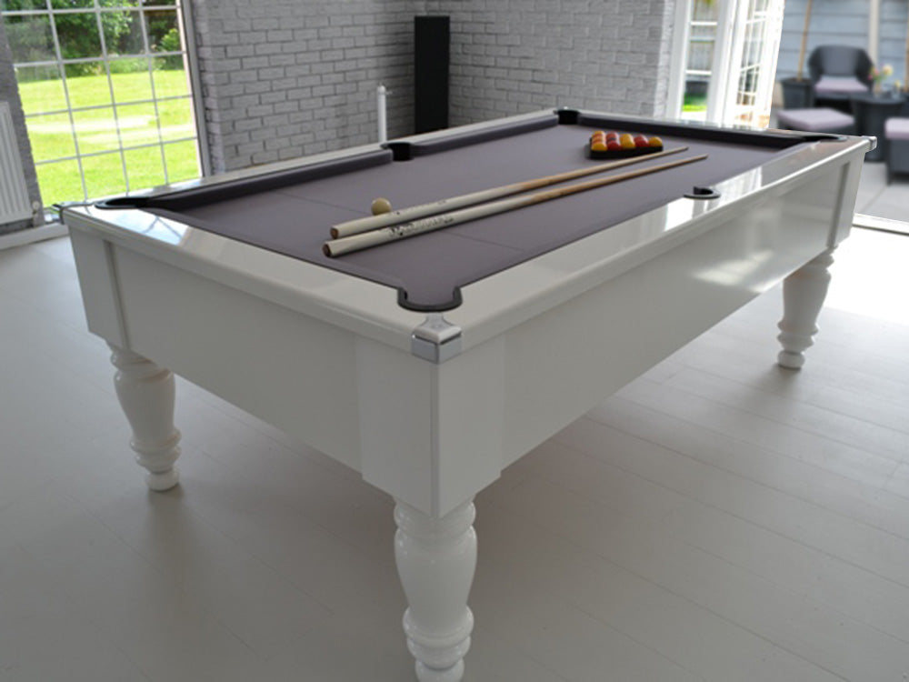 Gloss White Turned Leg Pool Table with grey cloth and chrome corners angled shot image on wooden floor.