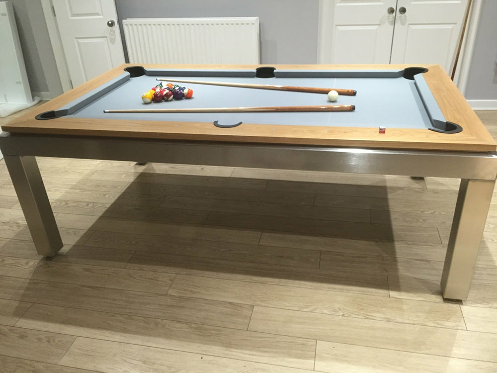 Manhatten 7ft Pool Table. Wooden top rail with metallic body and legs. Light blue cloth.
