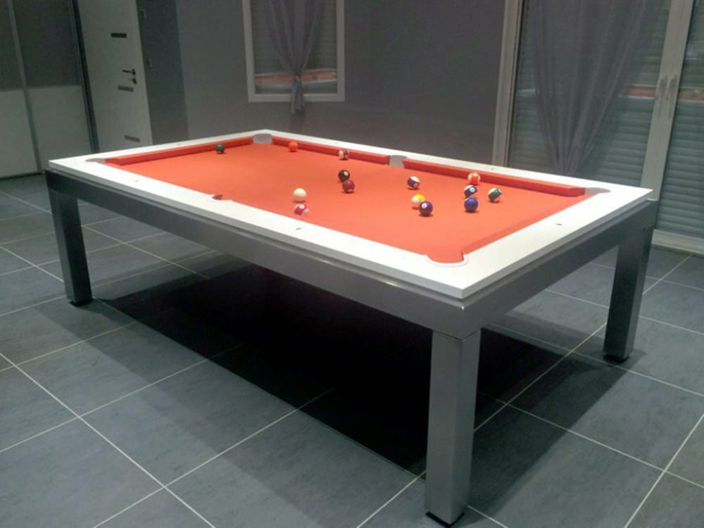 Manhatten 7ft Pool Table. White top rail with metallic body and legs. Red cloth with spots and stripe pool balls.