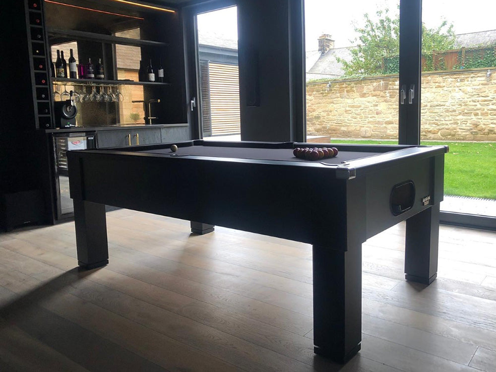 Matt Black Square Leg Pool Table in gmaes room with garden in the background,