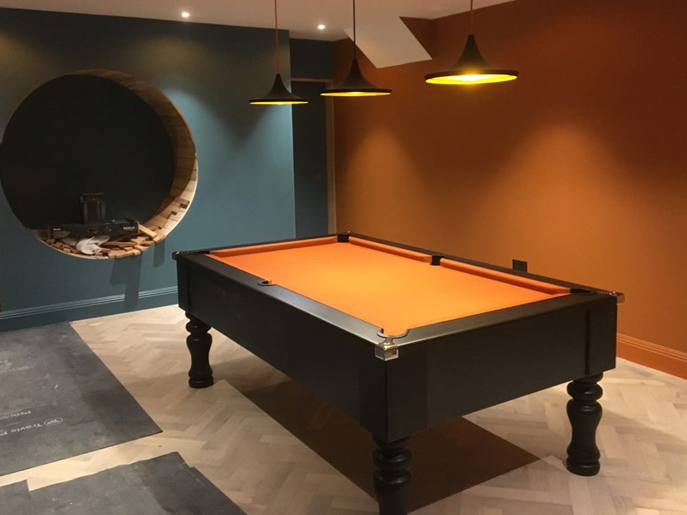British made, solid-wood turned leg 7ft pool table UK, featuring chrome corners and stunning modern matt finish. Orange cloth.