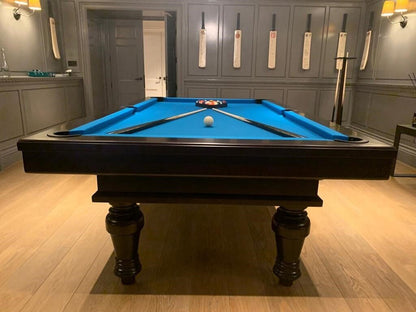 Elegant Pacha Pool Table in Black with electric blue cloth looking down pool table.