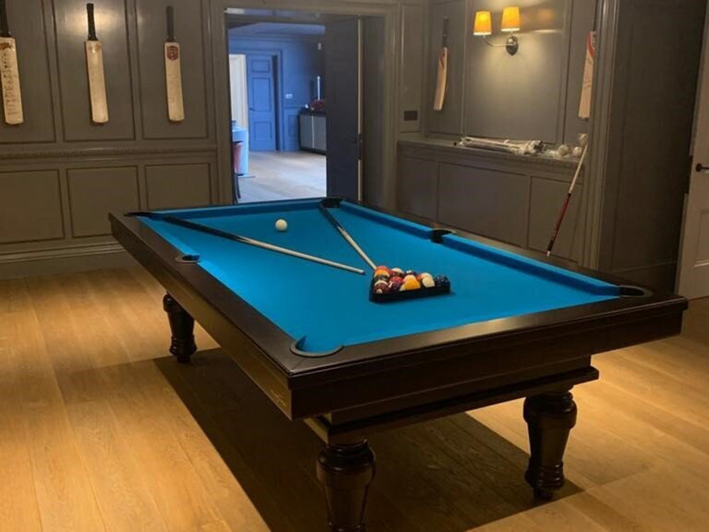 Angled shot of Pacha Pool Table in Black with electric blue cloth